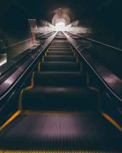 View of an escalator from the bottom.